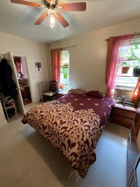 bedroom featuring ceiling fan and carpet floors