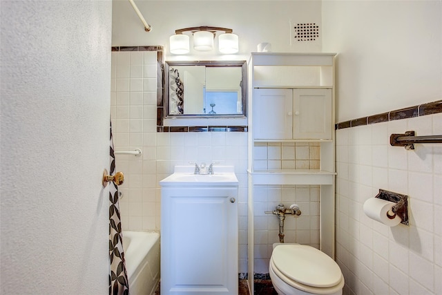 3901 Nostrand Ave Unit 3T, Brooklyn, NY 11235 - bathroom with tile walls, toilet, vanity, and shower / tub combination