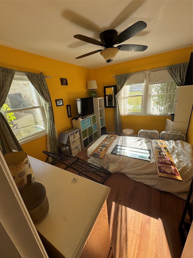 bedroom with wood finished floors and ceiling fan