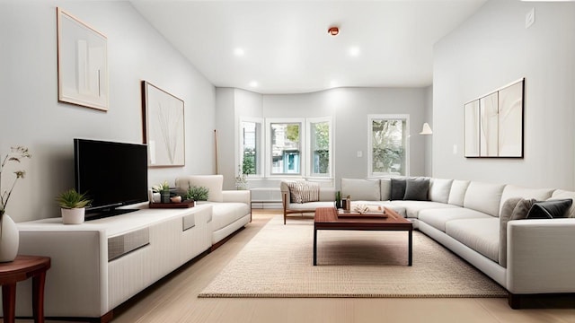 506 E 183rd St, Bronx, NY 10458 - living room featuring light wood-type flooring and recessed lighting