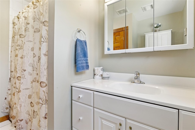 full bathroom with vanity and a shower with shower curtain
