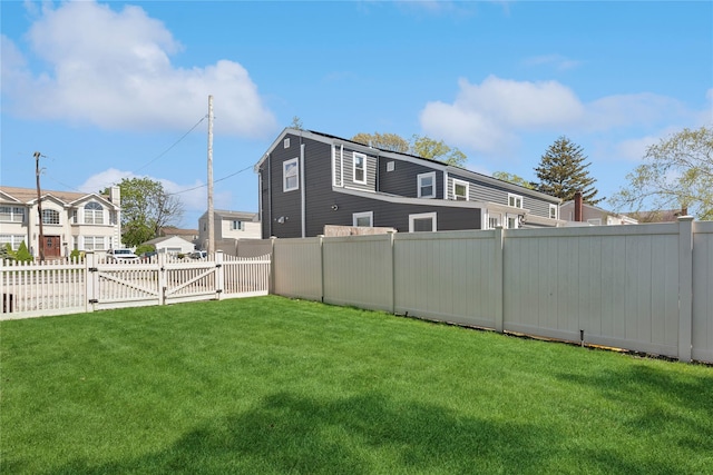 view of yard featuring a gate