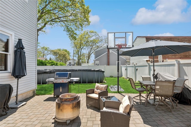 view of patio featuring area for grilling and outdoor dining area