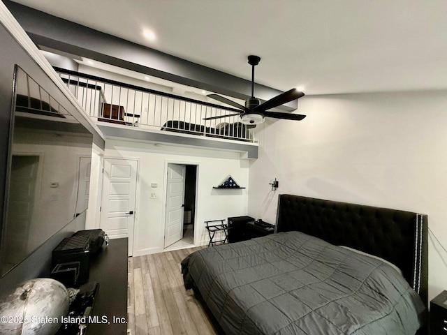 bedroom featuring wood finished floors and recessed lighting