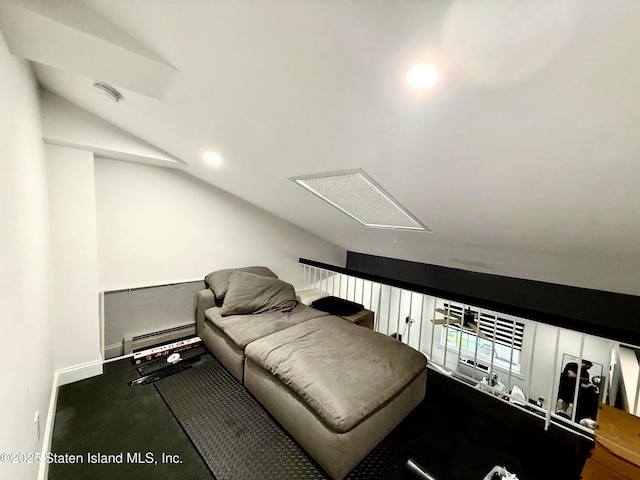 living area featuring attic access, a baseboard heating unit, lofted ceiling, and baseboards