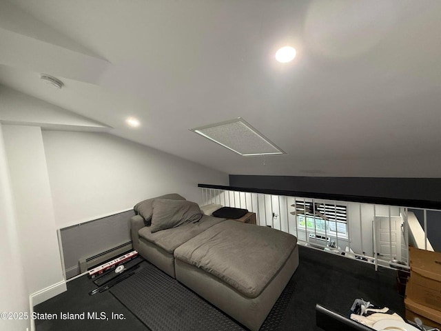 living area featuring vaulted ceiling, attic access, baseboard heating, and recessed lighting