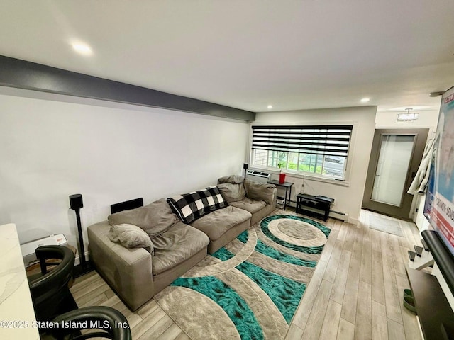 living area featuring light wood-style floors and recessed lighting