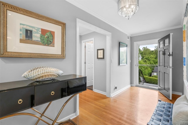 3 Briar Close Rd, Larchmont, NY 10538 - entryway featuring light wood finished floors, crown molding, baseboards, and a chandelier
