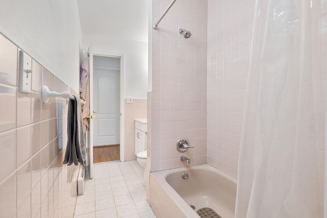50 New Pomona Rd, Suffern, NY 10901 - full bathroom featuring tile walls, shower / tub combo with curtain, tile patterned floors, and toilet