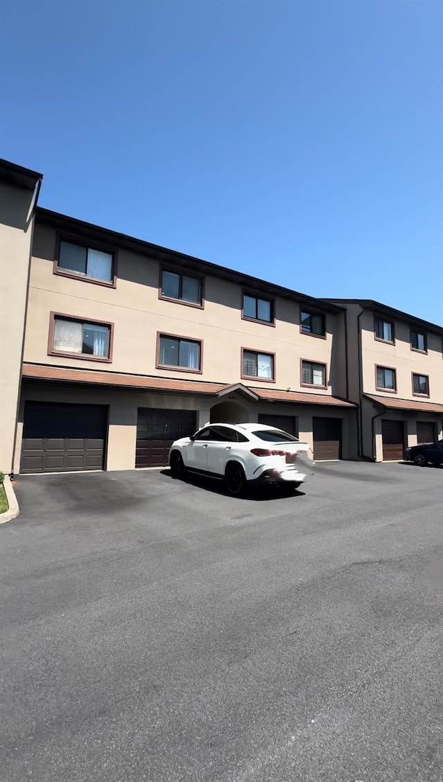 524 115th St Unit 524C, Flushing, NY 11356 - view of building exterior with an attached garage