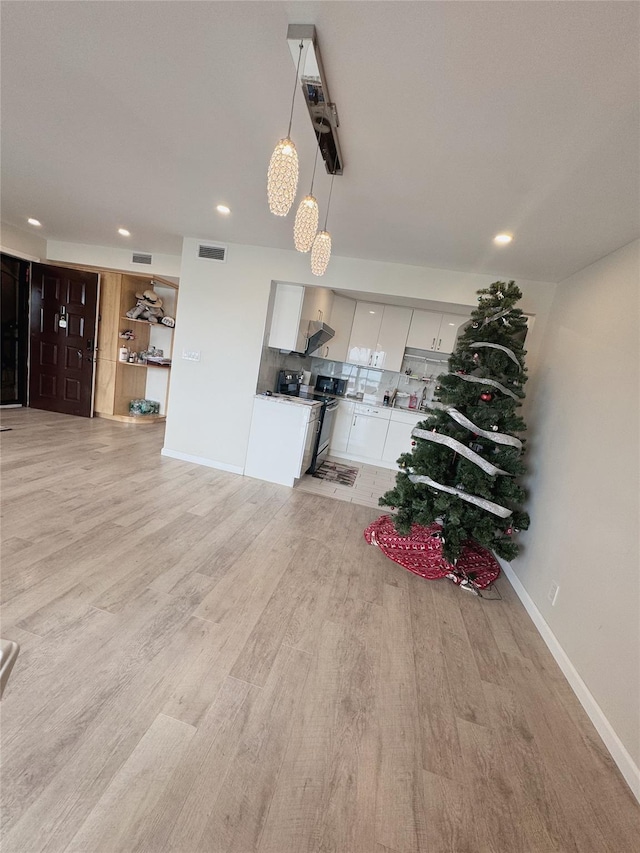 524 115th St Unit 524C, Flushing, NY 11356 - living room with light wood-type flooring and recessed lighting