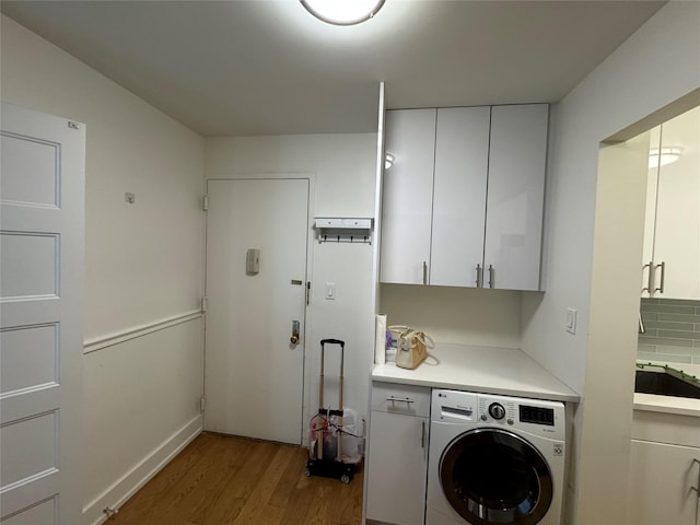 142-20 Franklin Ave Unit 2V, Flushing, NY 11355 - laundry area featuring washer / dryer, cabinet space, and light wood-style floors