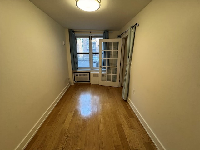 142-20 Franklin Ave Unit 2V, Flushing, NY 11355 - unfurnished room with dark wood finished floors, baseboards, and a wall mounted AC