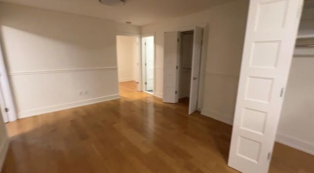 142-20 Franklin Ave Unit 2V, Flushing, NY 11355 - unfurnished bedroom featuring wood finished floors and baseboards