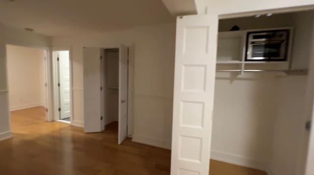 142-20 Franklin Ave Unit 2V, Flushing, NY 11355 - unfurnished bedroom featuring light wood-type flooring and baseboards