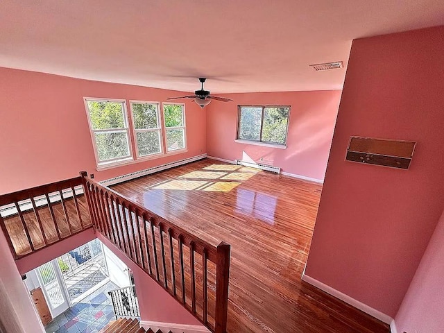 102 Maple St, Croton-On-Hudson, NY 10520 - living room with baseboards, ceiling fan, a baseboard radiator, and wood finished floors
