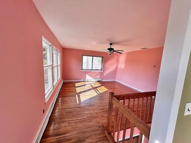 102 Maple St, Croton-On-Hudson, NY 10520 - spare room with baseboard heating, dark wood-type flooring, ceiling fan, and baseboards