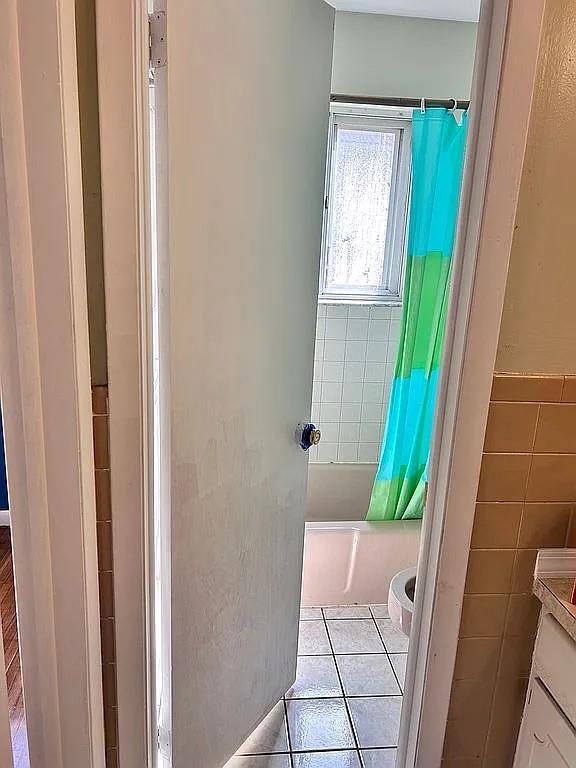102 Maple St, Croton-On-Hudson, NY 10520 - bathroom with tile patterned floors, shower / tub combo with curtain, vanity, and toilet