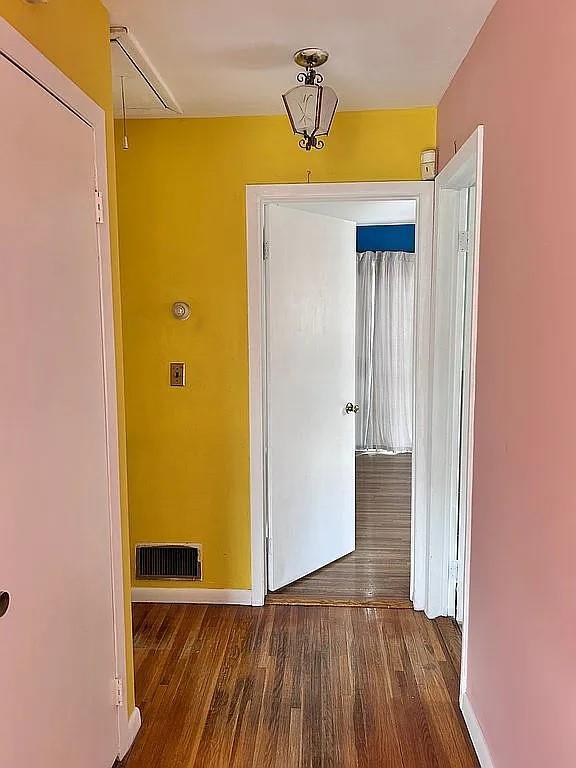 102 Maple St, Croton-On-Hudson, NY 10520 - hall featuring attic access, wood finished floors, and baseboards