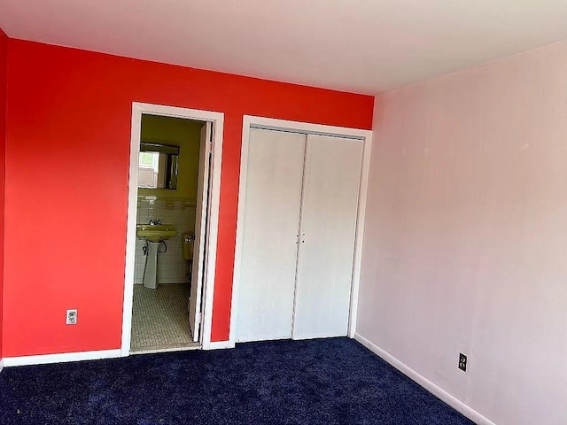 102 Maple St, Croton-On-Hudson, NY 10520 - unfurnished bedroom featuring dark colored carpet, a closet, baseboards, and ensuite bathroom