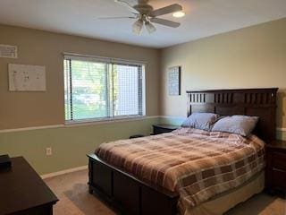 bedroom featuring baseboards and ceiling fan