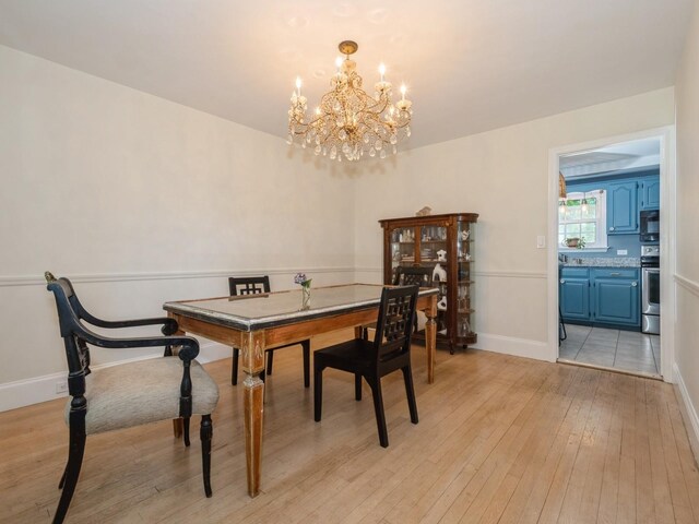 98 Jackson St, Fishkill, NY 12524 - dining space featuring a chandelier and light wood-type flooring