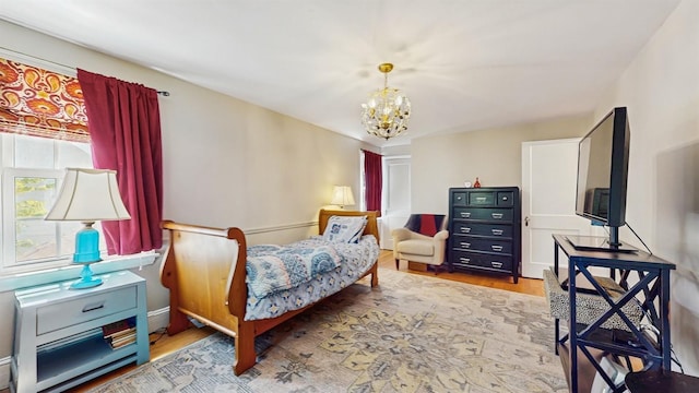 98 Jackson St, Fishkill, NY 12524 - bedroom with a chandelier and wood finished floors
