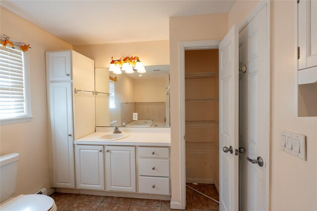 21 Pine Cone St, Middle Island, NY 11953 - full bath with toilet, healthy amount of natural light, vanity, and tile patterned flooring