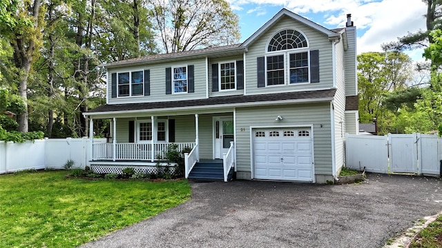 21 Pine Cone St, Middle Island, NY 11953 - view of front facade featuring a chimney, covered porch, an attached garage, a gate, and driveway