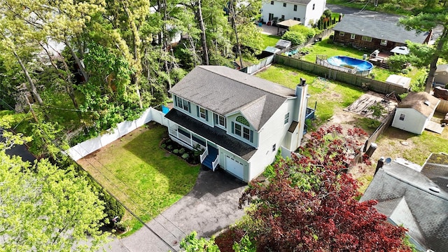 21 Pine Cone St, Middle Island, NY 11953 - view of subject property with a pool area