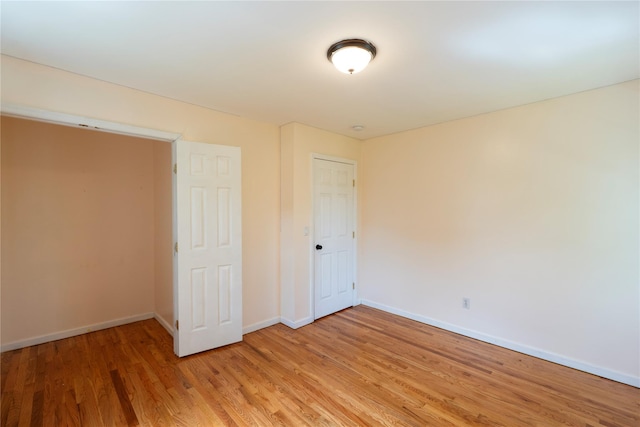 21 Pine Cone St, Middle Island, NY 11953 - unfurnished bedroom with light wood-style floors and baseboards