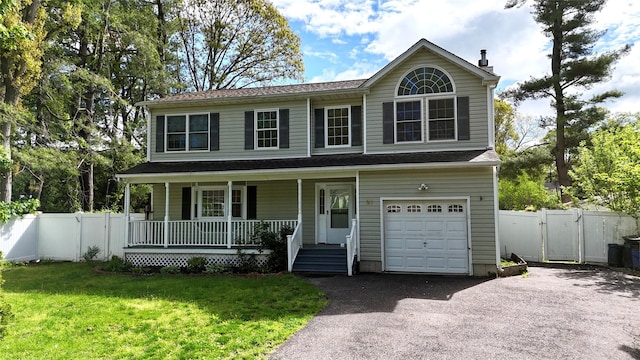 21 Pine Cone St, Middle Island, NY 11953 - view of front of home featuring covered porch, a gate, asphalt driveway, and an attached garage