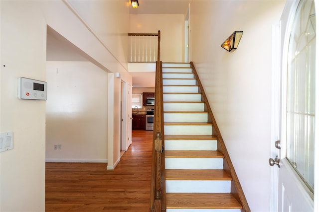 21 Pine Cone St, Middle Island, NY 11953 - staircase featuring wood finished floors and baseboards