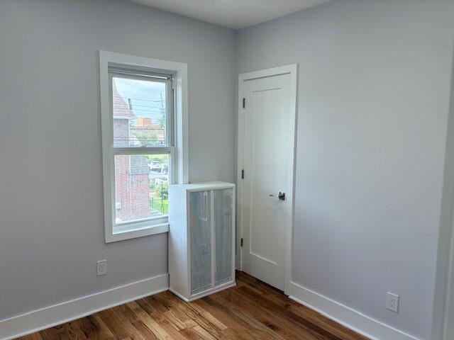187-02 Foch Blvd, Saint Albans, NY 11412 - empty room with wood finished floors and baseboards