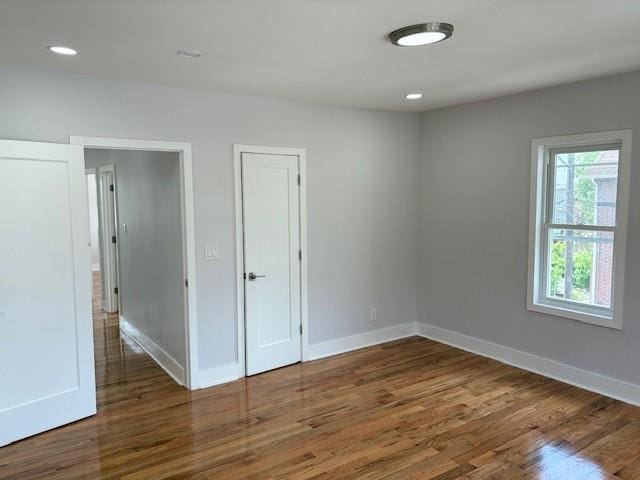 187-02 Foch Blvd, Saint Albans, NY 11412 - empty room featuring wood finished floors, baseboards, and recessed lighting