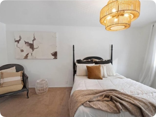 bedroom featuring carpet flooring and baseboards