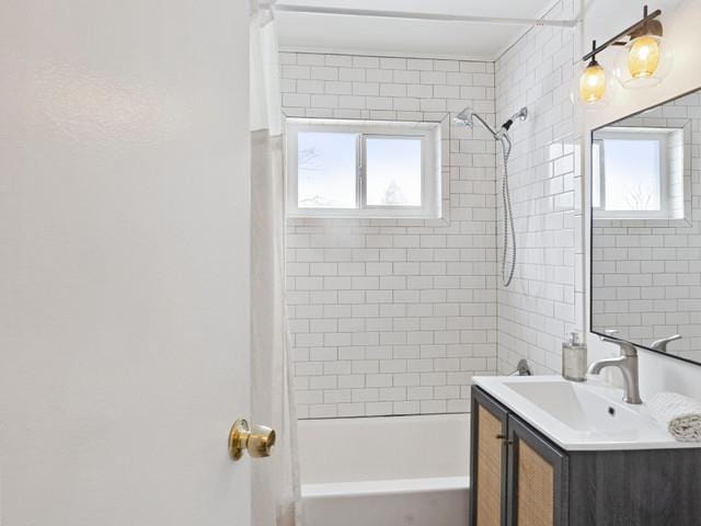 full bathroom featuring plenty of natural light, shower / bath combination with curtain, and vanity