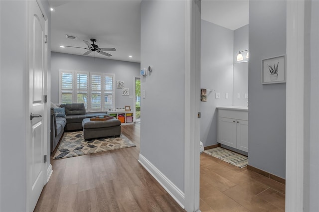 27 Lager Ln, Patchogue, NY 11772 - corridor featuring wood finished floors, recessed lighting, and baseboards