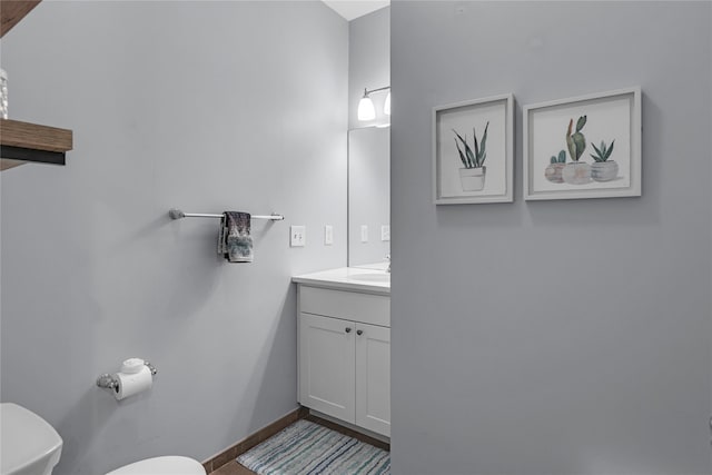 27 Lager Ln, Patchogue, NY 11772 - half bath featuring toilet, vanity, and baseboards