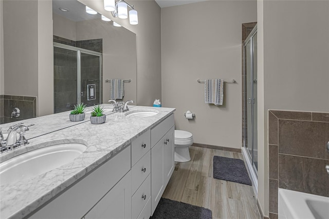 27 Lager Ln, Patchogue, NY 11772 - full bath featuring a stall shower, double vanity, toilet, and a tub