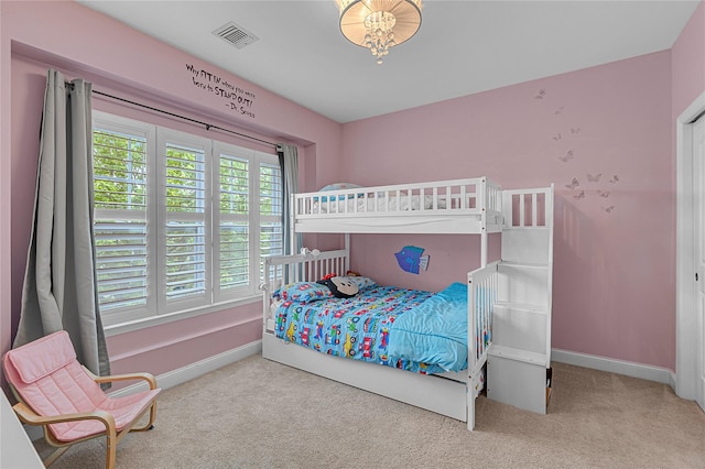 27 Lager Ln, Patchogue, NY 11772 - bedroom with carpet floors and baseboards