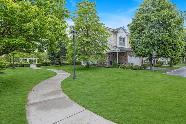 27 Lager Ln, Patchogue, NY 11772 - view of front of property with stone siding, a front yard, a garage, and driveway