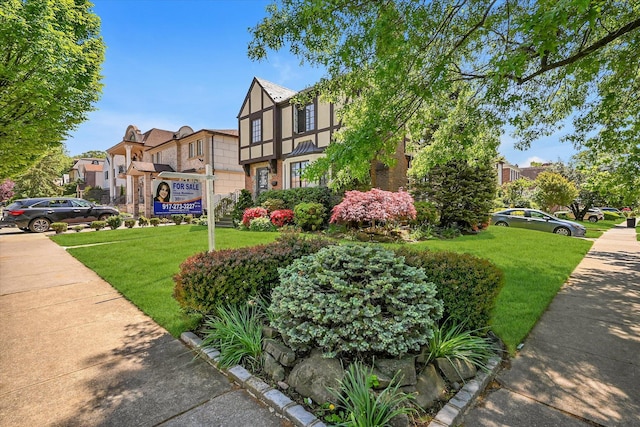 182-04 80th Dr, Jamaica Estates, NY 11432 - view of home's community featuring a lawn and a residential view