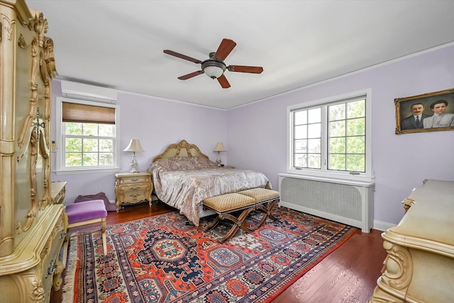 182-04 80th Dr, Jamaica Estates, NY 11432 - bedroom with radiator, wood finished floors, a ceiling fan, and baseboards