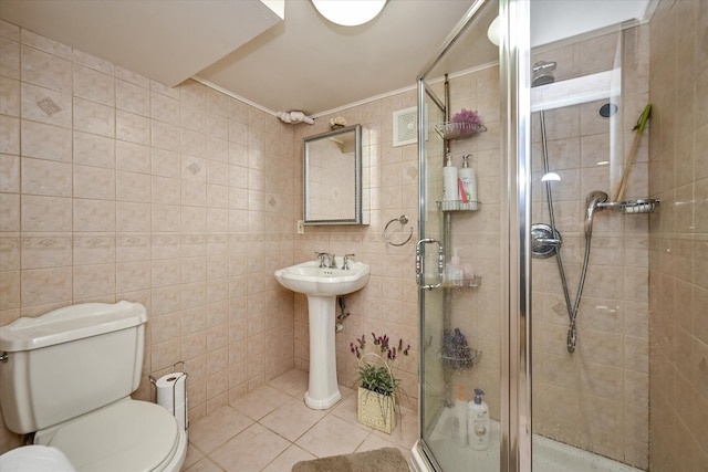 182-04 80th Dr, Jamaica Estates, NY 11432 - bathroom with a stall shower, tile walls, toilet, tile patterned floors, and ornamental molding
