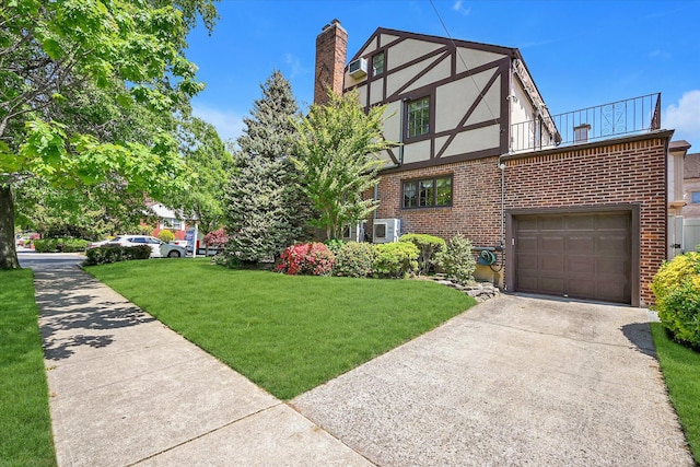182-04 80th Dr, Jamaica Estates, NY 11432 - english style home featuring stucco siding, a chimney, brick siding, and driveway