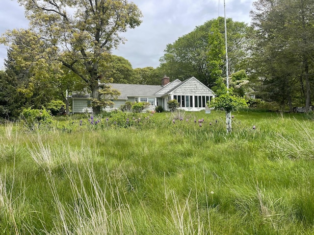1015 Knollwood Ln, Mattituck, NY 11952 - view of front of house featuring a chimney