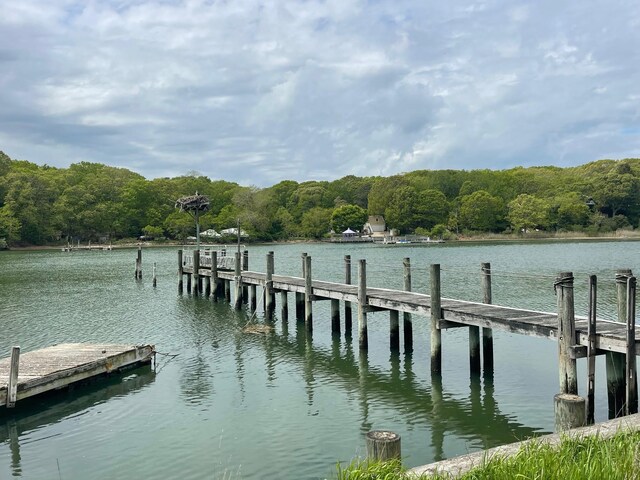 1015 Knollwood Ln, Mattituck, NY 11952 - dock area featuring a water view and a wooded view