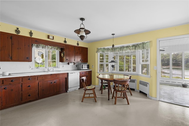 1015 Knollwood Ln, Mattituck, NY 11952 - kitchen featuring white dishwasher, radiator, stainless steel microwave, light countertops, and pendant lighting
