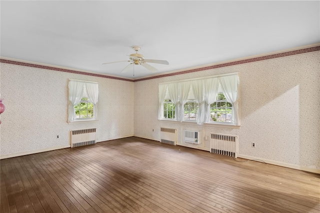 1015 Knollwood Ln, Mattituck, NY 11952 - unfurnished living room featuring radiator, wood-type flooring, a ceiling fan, wallpapered walls, and ornamental molding